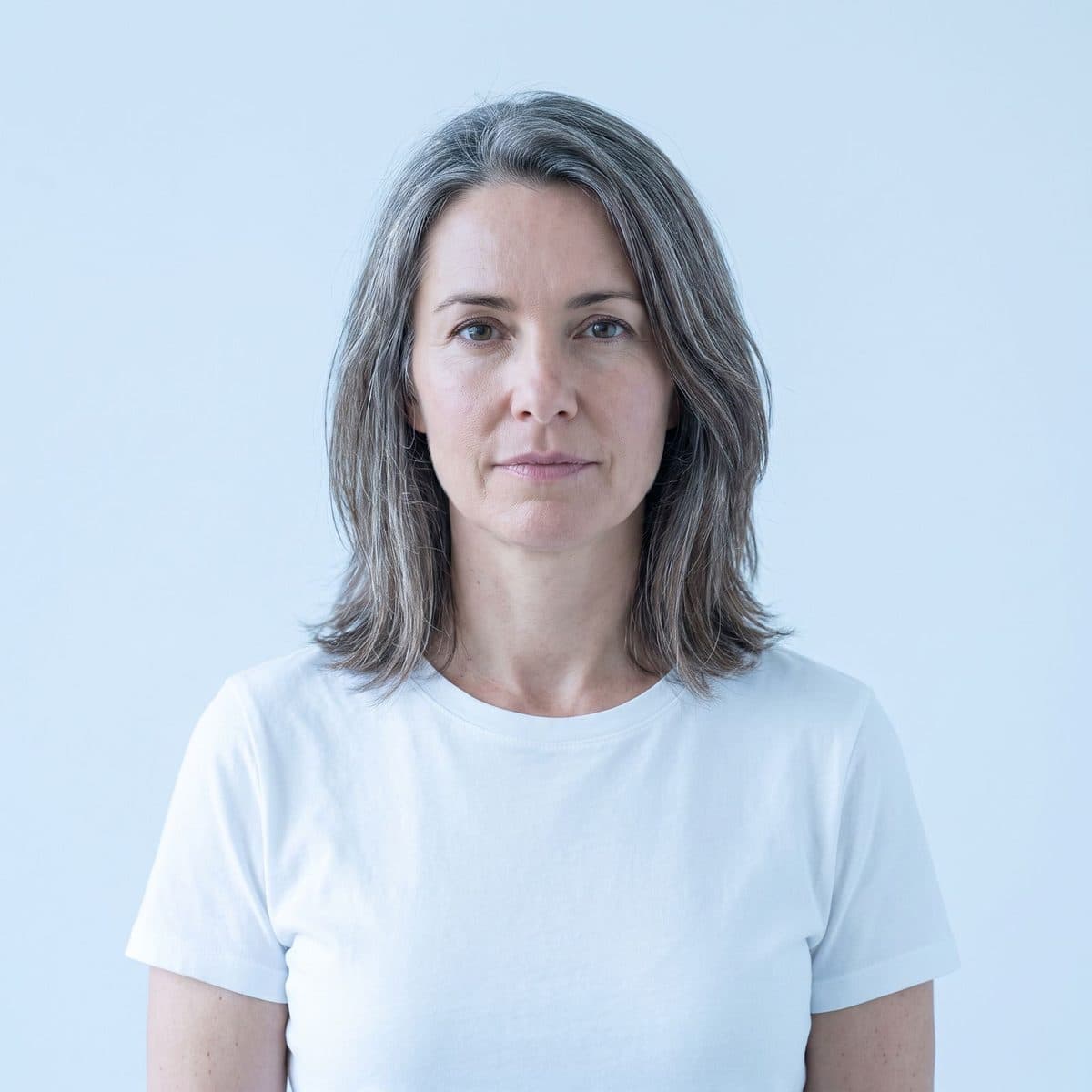 Woman in her forties looking straight at the camera.